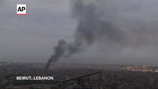 Officials search for survivors in Beirut after buildings destroyed by Israeli airstrike.