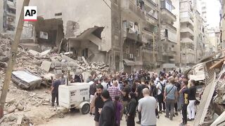 Speaker of Iran parliament visits site where Israeli strike destroyed building.