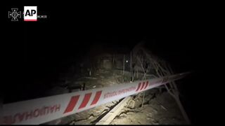 Ukrainian emergency workers search rubble after Russian airstrike on Zaporizhzhia.