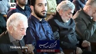 Iranian paramilitary leader whose status was in question is shown on state TV.