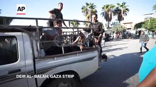 Relatives mourn six Palestinians killed in Israeli strike on car in central Gaza.