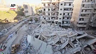 Aftermath of Israel strikes on Hezbollah's financial arm in Beirut.