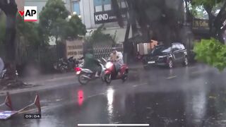 Typhoon Trami causes heavy rain and strong winds as it moves closer to Vietnam's coast.