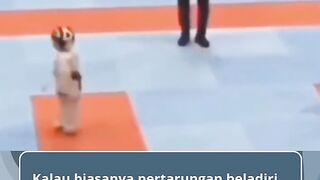 funny action of two little karate fighters