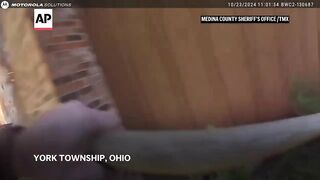Body cam video shows police rescuing woman from burning home in Ohio.