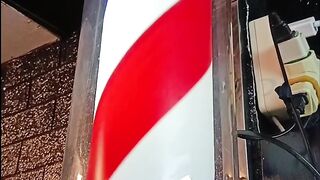 indoor barber  lamp post red blue and white
