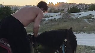 muscular man riding a horse