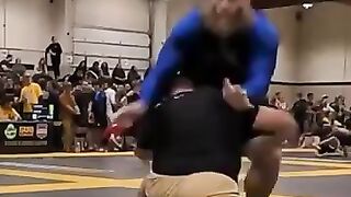 Wrestler blast doubles ultra heavyweight blue belt across the mat