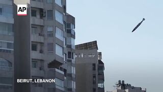 AP photographer captures bomb falling in his childhood neighborhood in Beirut.