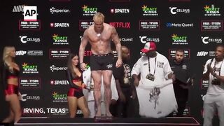 Mike Tyson slaps Jake Paul during their weigh-in before fight.