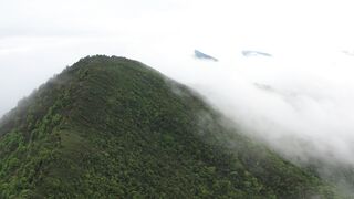 Beautiful clouds roaming around the mountains.