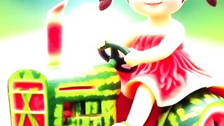 Little Girl plays with fruits Tractor