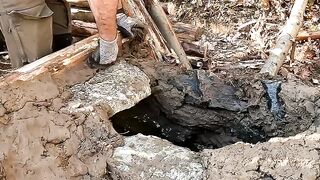 Build bushcraft survival shelter in the forest