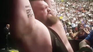 Reaction of the public to a bodybuilder lifting heavy weights.