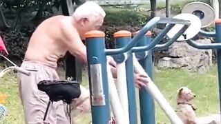 old man trains with his dogs