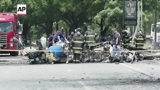 Firefighters remove debris from plane crash in Sao Paulo.