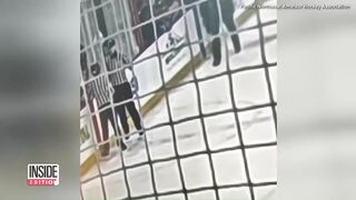 Dad Pushes Young Teen Hockey Referees To the Ground.