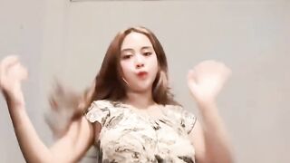 Dancing in the room wearing that sexy dress