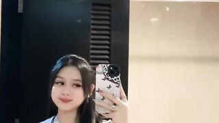 In the bathroom in front of the room