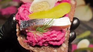 New Year's appetizer with black bread, herring and savory beetroot sauce