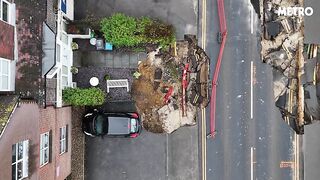 In the village of Surrey Scenes of sinkholes swallowing the road