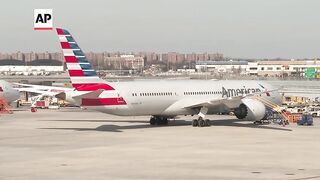 Passengers react after New York-New Delhi flight diverts to Rome due to security concern.