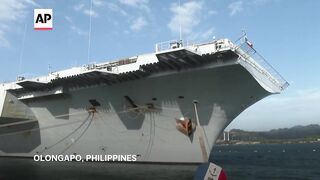 French aircraft carrier docks in Philippines after joint combat drills in disputed South China Sea.