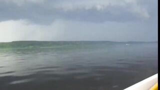 Escaping from a thunderstorm on a motorboat