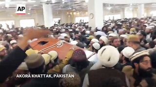 Thousands of mourners attend funeral for Taliban-linked cleric killed in Pakistan’s northwest.