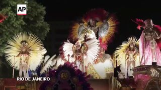 Rio's top samba schools parade take center stage on first night of Carnival.