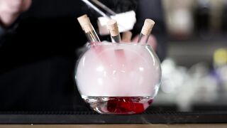 Bartender makes an experimental cocktail