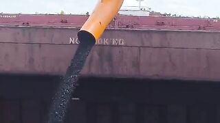 Coal loading by floating crane