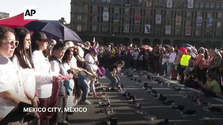 Vigil in Mexico City after discovery of alleged Mexican cartel 'extermination site'.