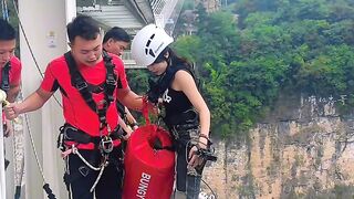 brave woman throws herself from a height