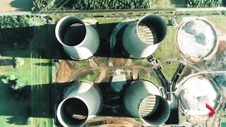 Four UK power station cooling towers demolished in controlled implosion.