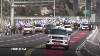 Israeli protesters march into Jerusalem against Netanyahu government.