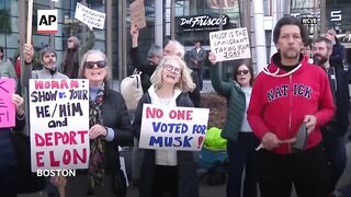 Hundreds gather outside Tesla showroom in Boston to protest Elon Musk.