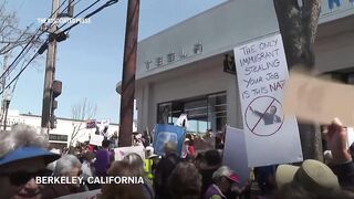 Protest against Elon Musk's purge of US government at Tesla dealership.
