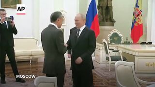 Putin meets with China's Foreign Minister Wang Yi in Russia