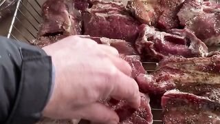A barbecue in men's hands is a ritual that can be watched forever