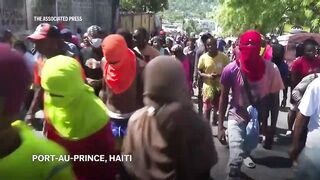 Gunfire erupts in Haiti as thousands protest a surge of gang violence.