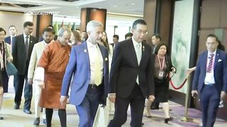 Foreign ministers at Bangkok meeting stand in silence for earthquake victims.