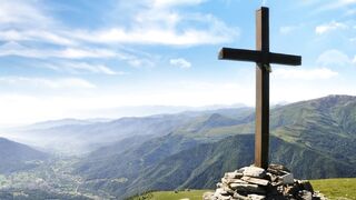 Cross in nature background