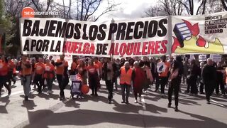 Thousands march through Madrid demanding action to reduce costs of rental property.