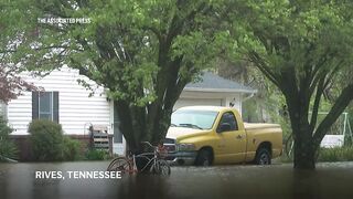 Residents of a Tennessee town evacuate after homes are flooded.