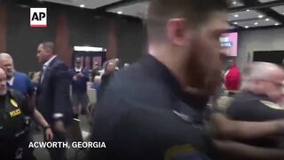 Protester tased by police at Marjorie Taylor Greene's Georgia town hall.