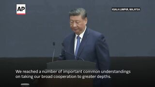 Xi Jinping says China will stand with Malaysia in withstanding global economic woes.