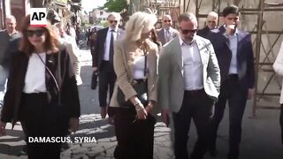 Congress members pay an unofficial visit to Syria.