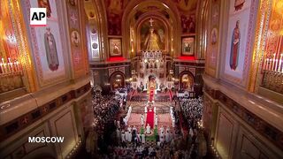 Putin attends Orthodox Easter midnight Mass at Moscow cathedral.