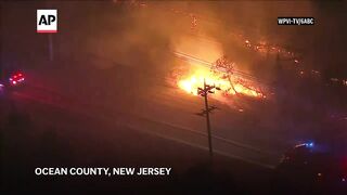 New Jersey forest fire prompts evacuations and closes a major highway.